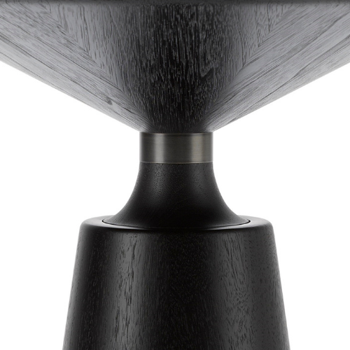 Close-up of a dark wooden table leg and a black metal base.