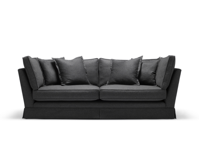 A black sofa with multiple matching cushions on a white background.