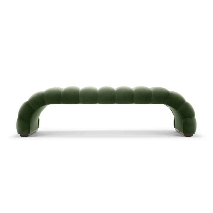 Green modern curved sofa with a unique segmented design.