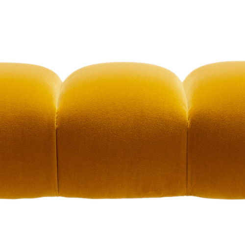 Close-up of a yellow upholstered sofa with three cushioned sections against a white background.