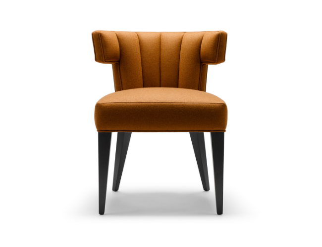 An orange upholstered chair with black wooden legs, featuring a wingback design.