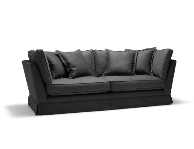 Black sofa with multiple black cushions against a plain white background.