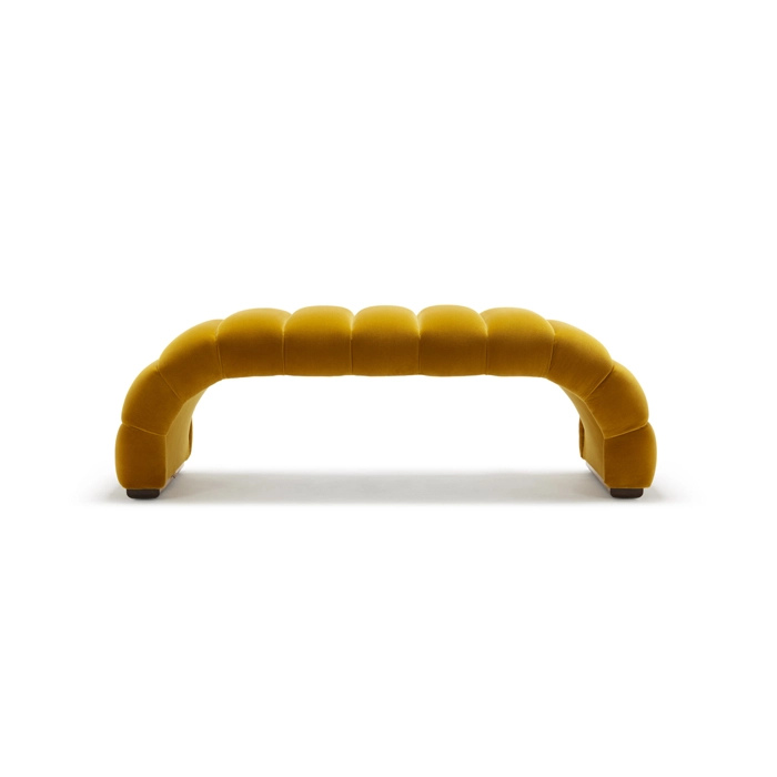 Yellow curved sofa with a modern design on a plain white background.