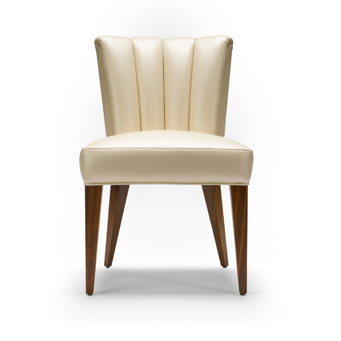 Cream-colored upholstered chair with dark wooden legs, set against a plain white background.
