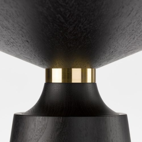 Close-up of a modern black and gold pedestal with a textured black surface and a gold band, supporting a large black cone-shaped object.