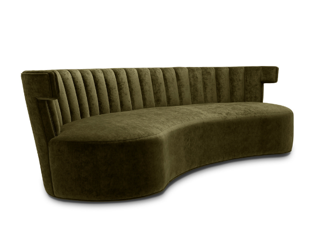 Olive green velvet upholstered curved sofa with vertical tufted backrest and armrests.