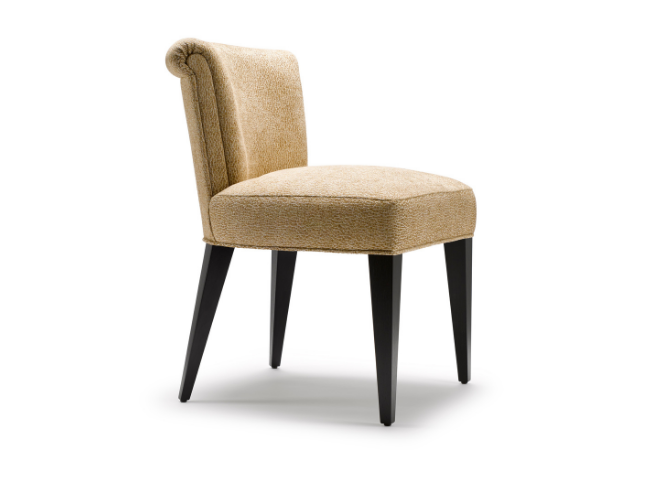 A beige upholstered chair with four black wooden legs and a tufted backrest.