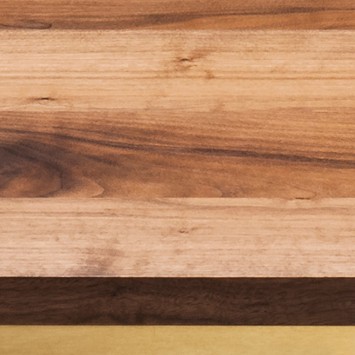Close-up of different types of wood panels arranged horizontally.