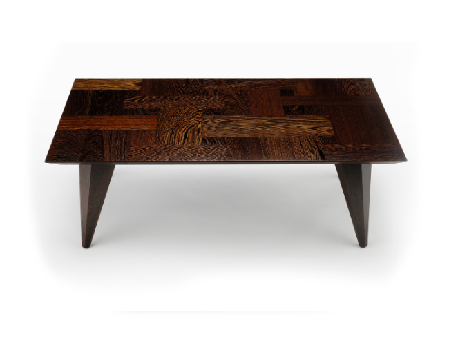 Wooden coffee table with a patterned top and angled legs on a white background.