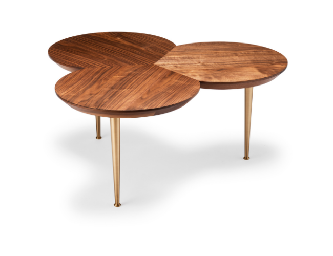 Three overlapping round wooden tables with three gold-colored tapered legs.