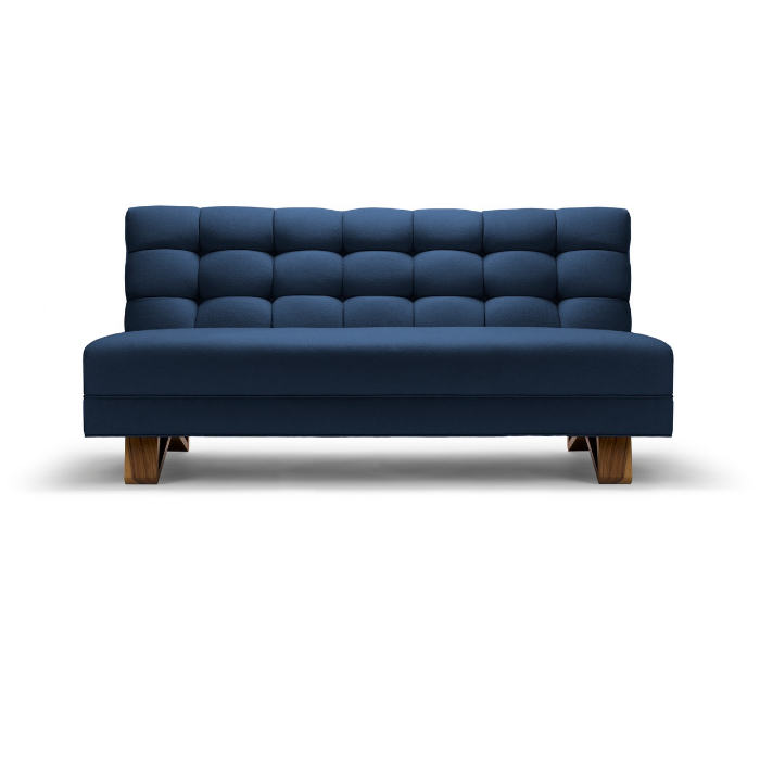 Blue upholstered sofa with tufted back and wooden legs