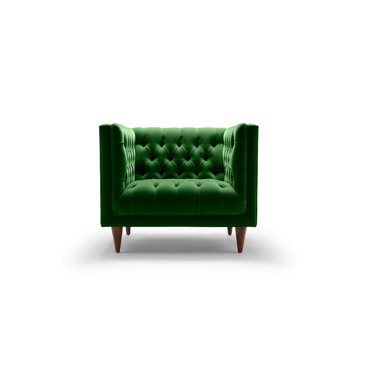 Green upholstered armchair with tufted design on white background.