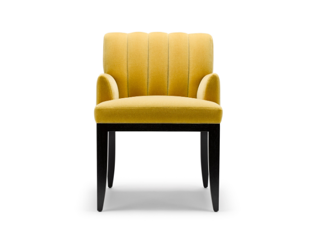 A yellow upholstered armchair with black wooden legs on a white background.