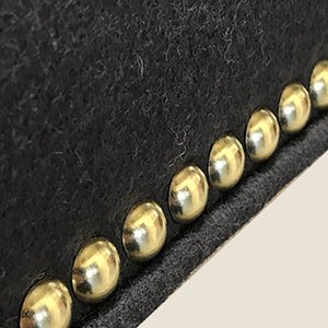 Nickel, one of the decorative nailing finishes for Stuart Scott Furniture in Wiltshire, England