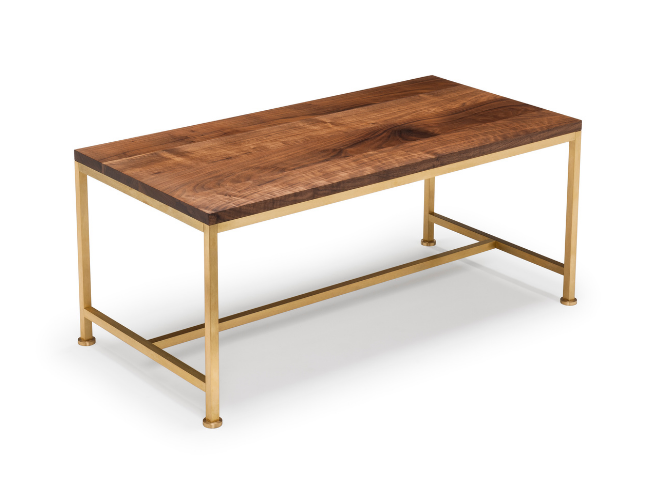 Wooden table with a metal frame and legs, light gold color, and a polished wood tabletop.