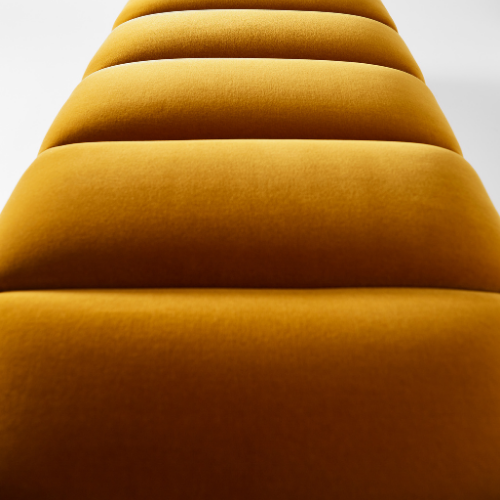 Close-up of a yellow, textured, segmented seating or padding.