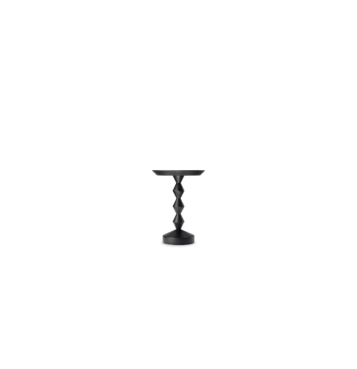 Black side table with a sculptural, geometric stacked design and a round top.