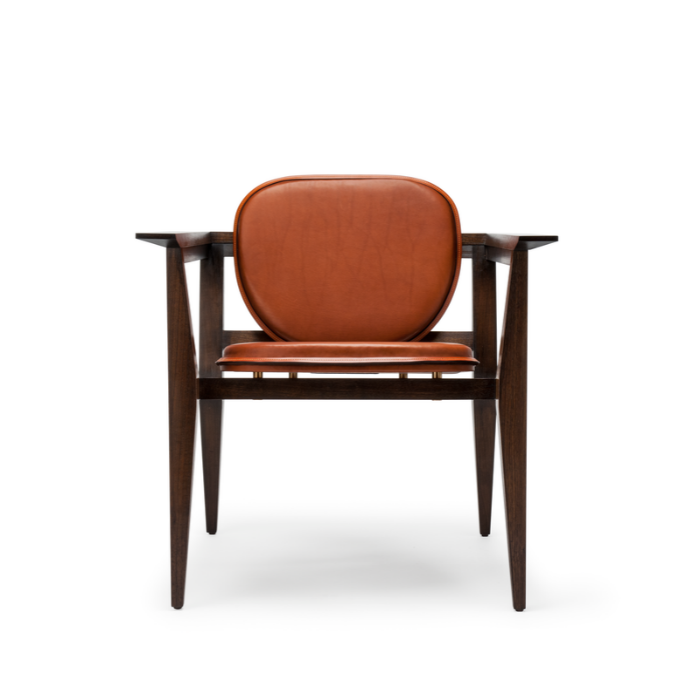 Modern wooden armchair with leather cushions and backrest, white background