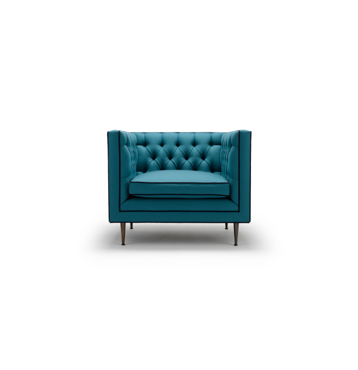 Blue tufted armchair with wooden legs on a white background.