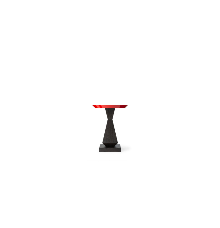 A small side table with a red top and a black, textured, hourglass-shaped pedestal base on a white background.