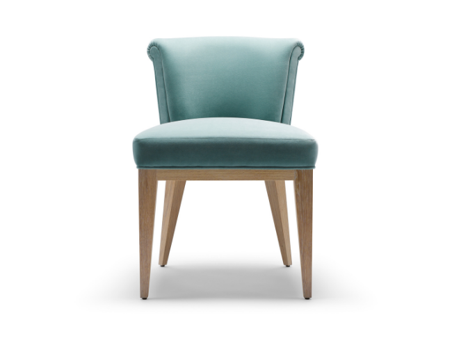 A light blue upholstered chair with a curved backrest and wooden legs.