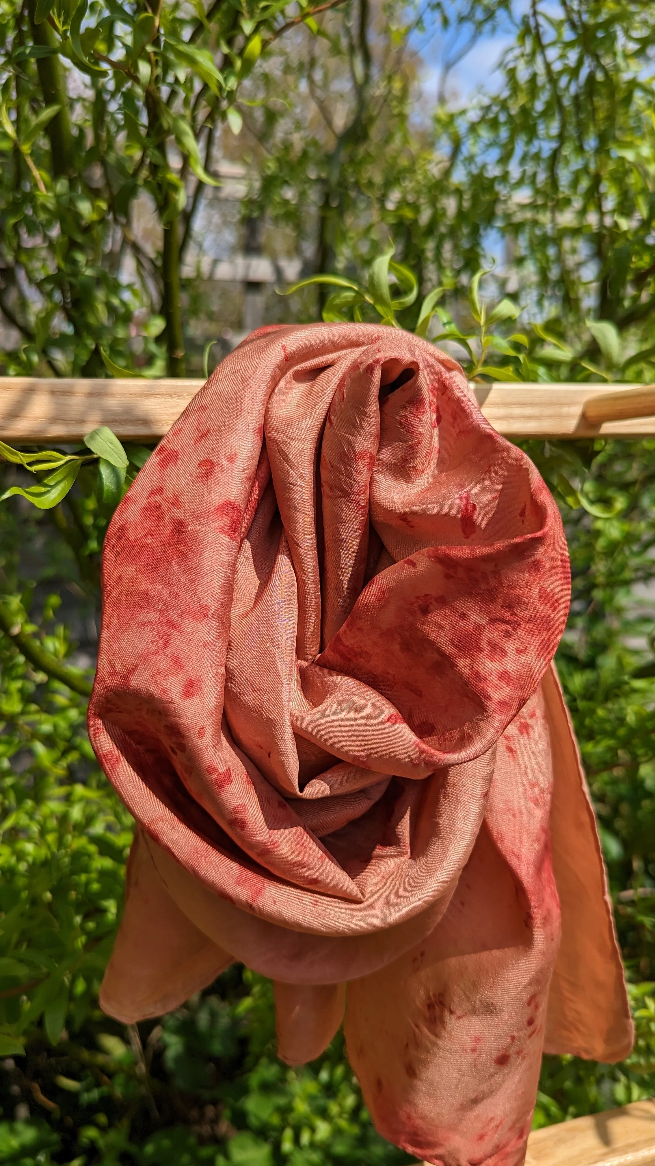 Dark madder silk scarf looped on display ladder.jpg