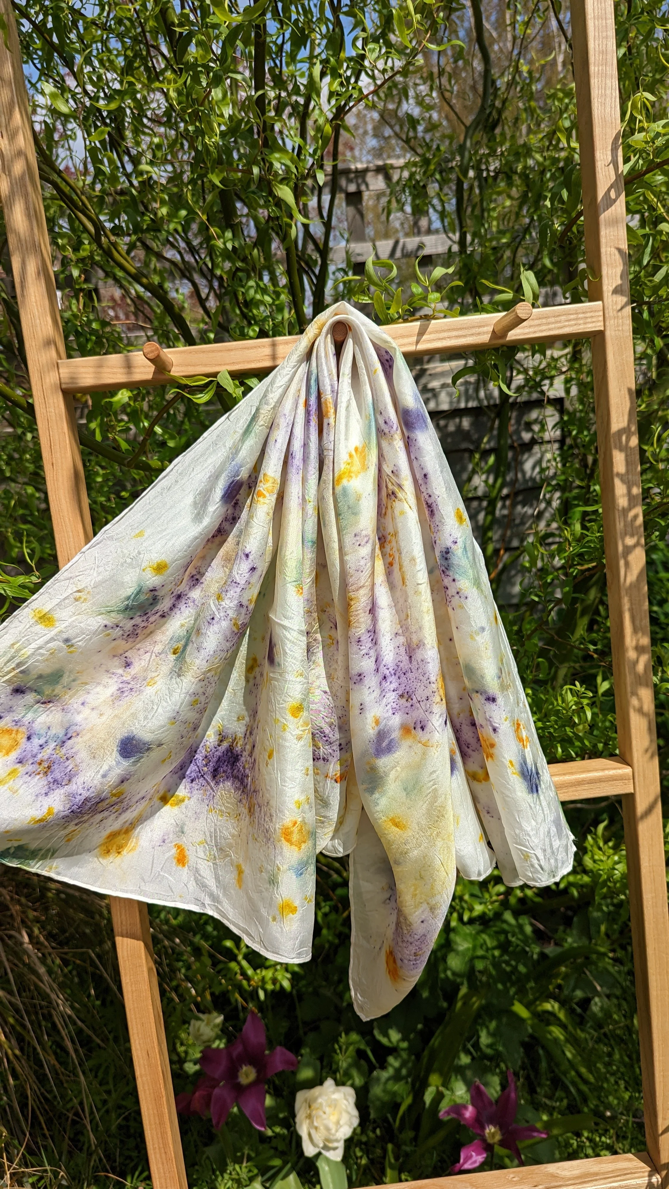 Steamed flower silk scarf hung on display ladder.jpg