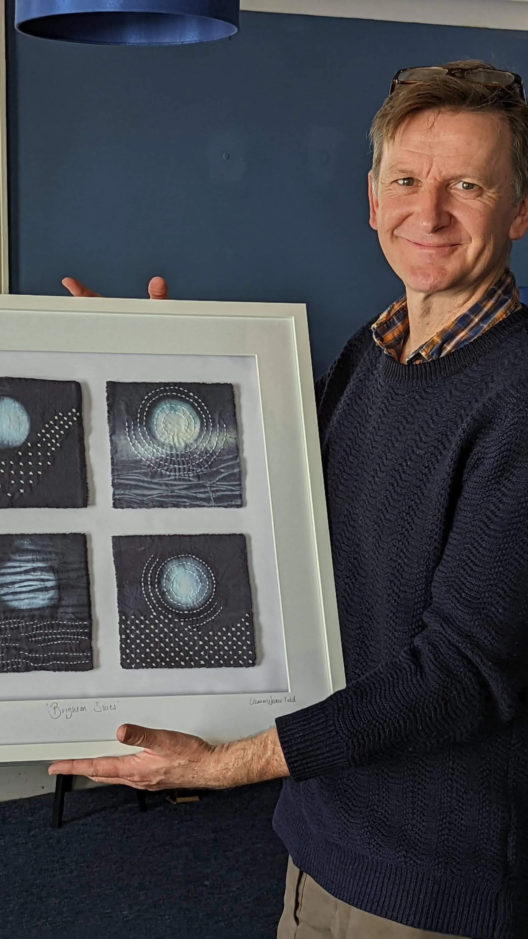 Brighton shibori sashiko commission framed with commissioner.jpg