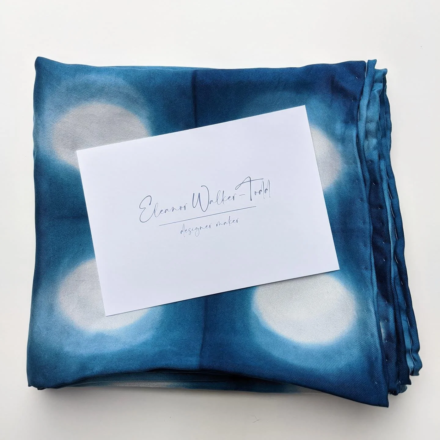 Shibori silk scarf folded with business card.jpg