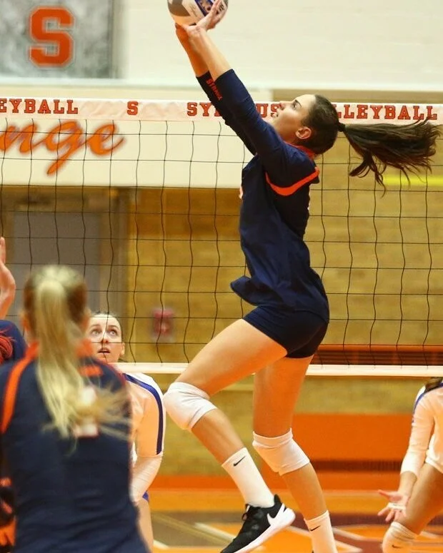 Elena Karakasi sets for Syracuse in a match vs. Pitt (Photo credit: Syracuse Athletics)