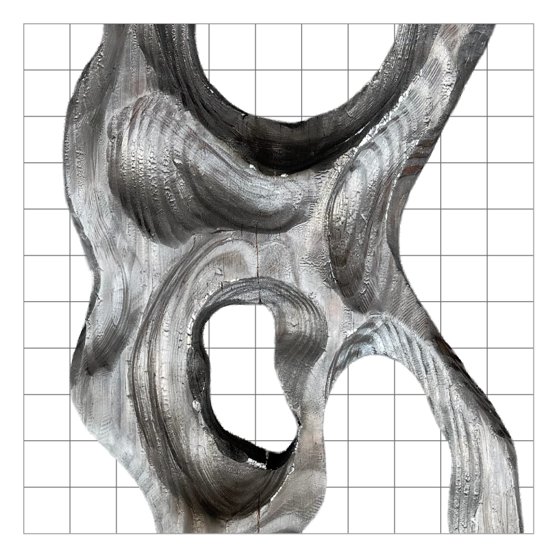 Close-up of a torched, textured wood sculpture with organic, swirling patterns and holes.
