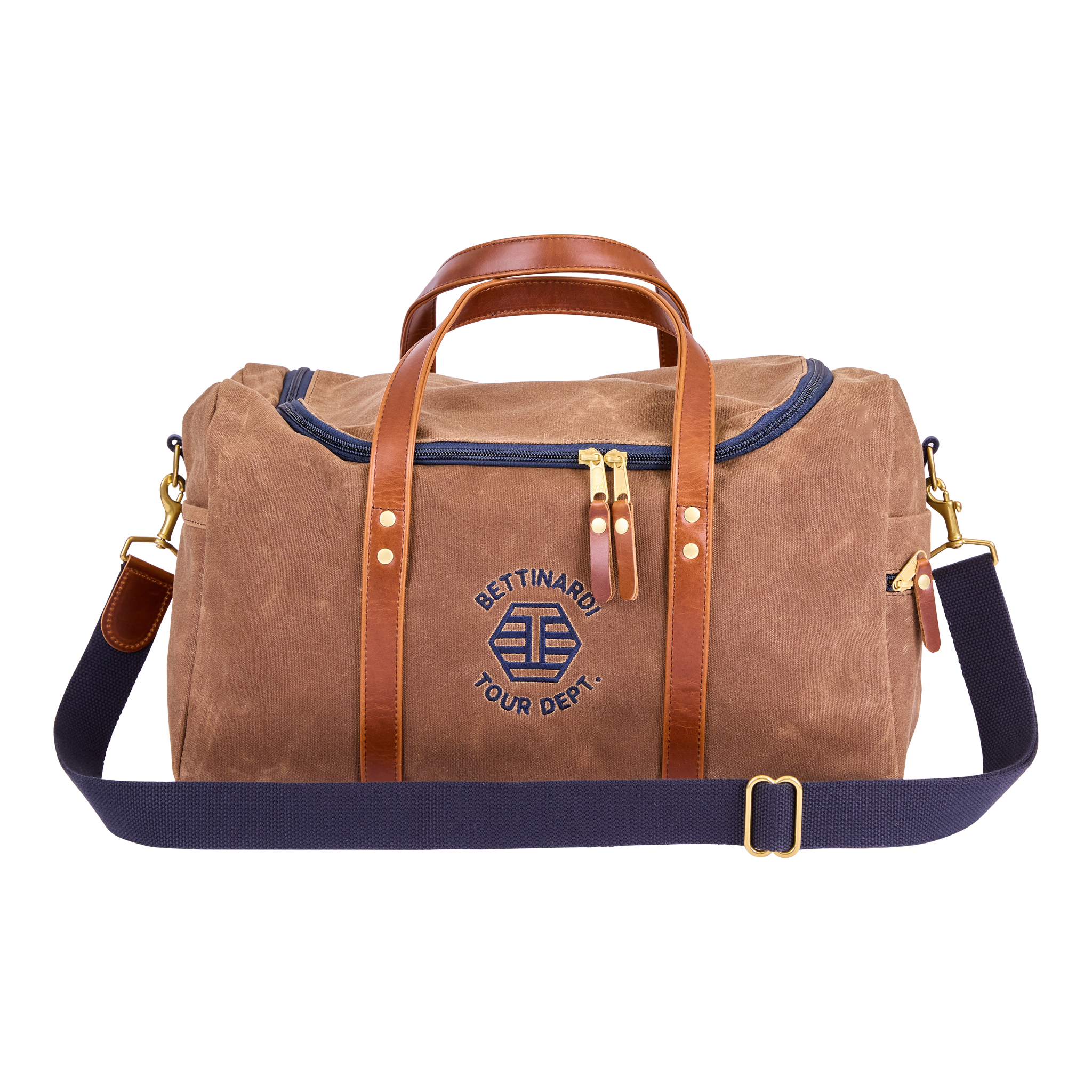 A tan duffle bag with brown leather handles and a navy blue zipper, with a logo reading "BETTINGARD YOUR DEPT" embroidered on the front.