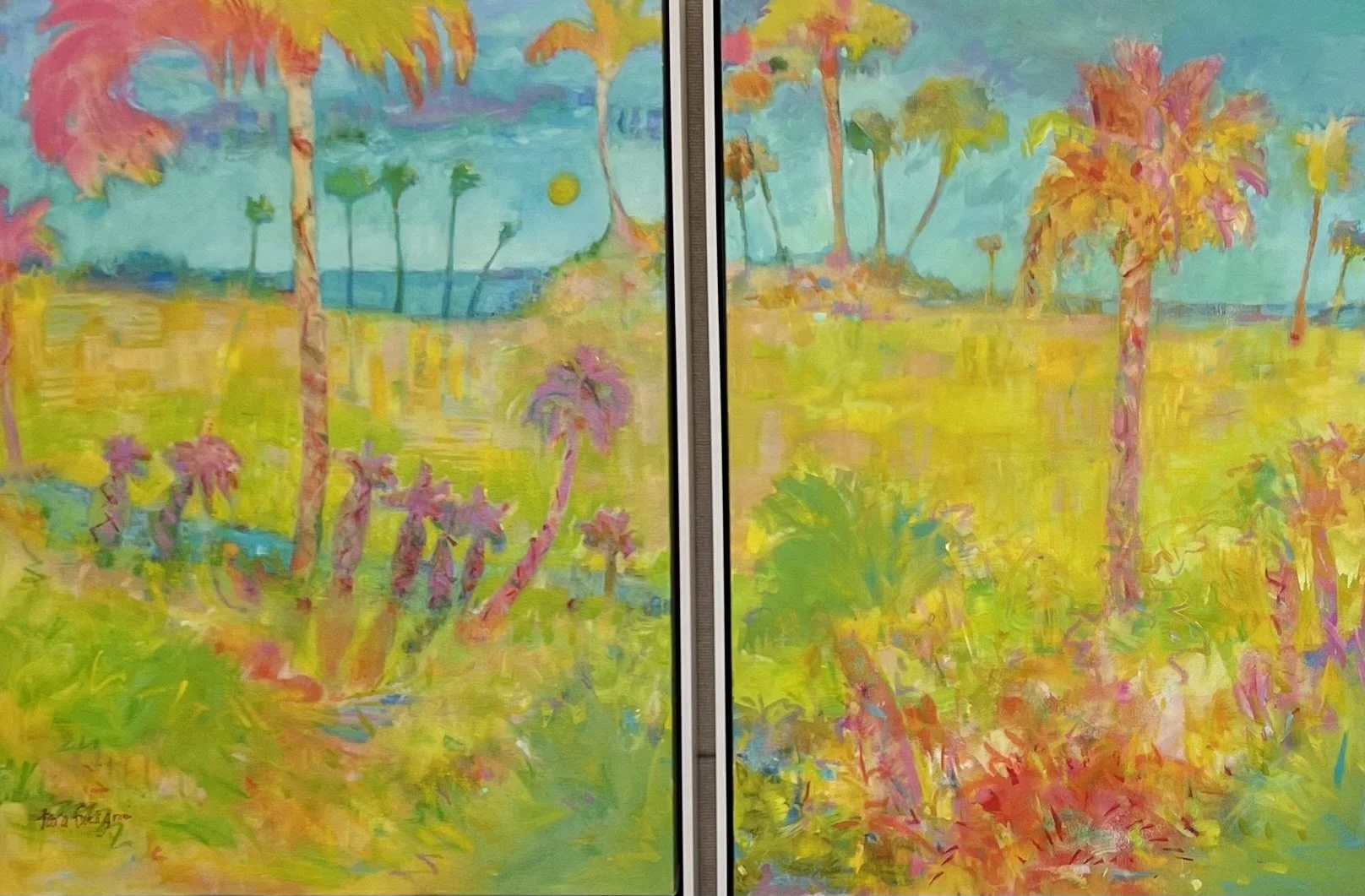 Two vibrant landscape paintings of a tropical scene with palm trees, bright green grass, and a blue sky with yellow and orange accents, mounted on a wall. Tara Funk Grim Art.