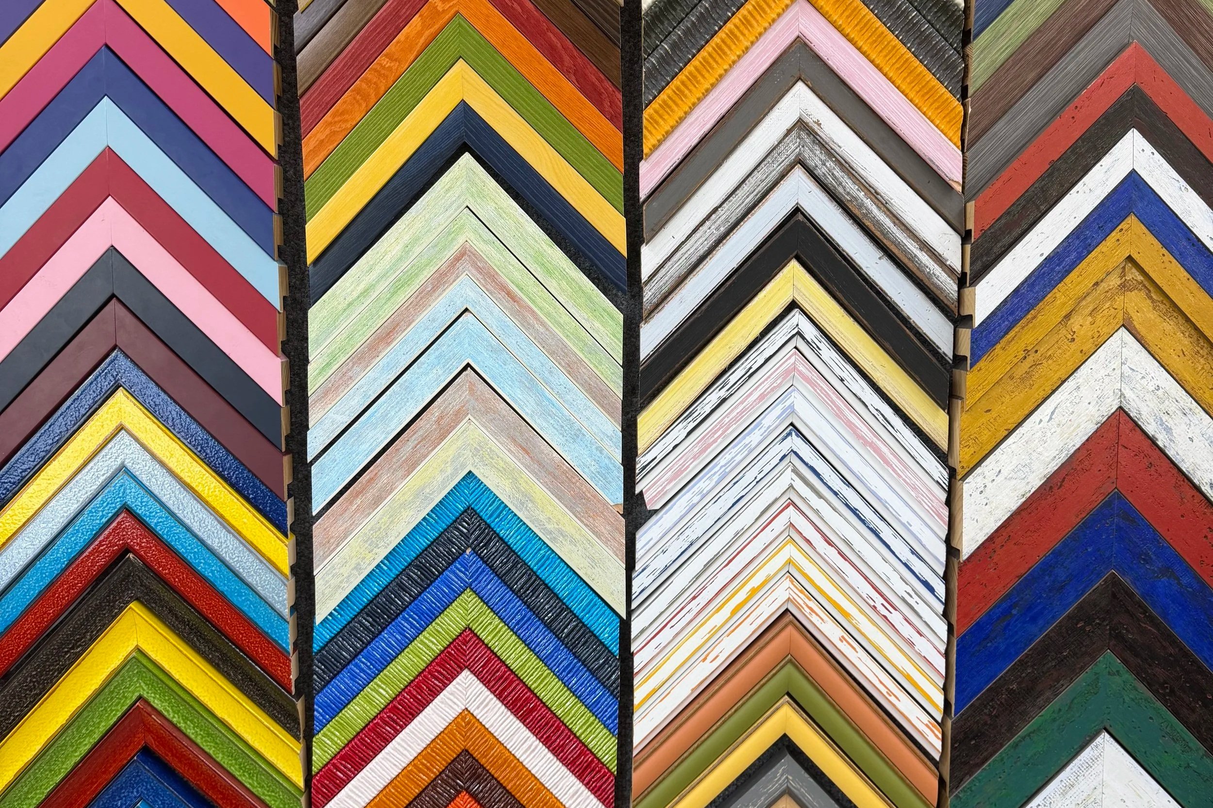 Colorful array of picture frame corner samples in a display.