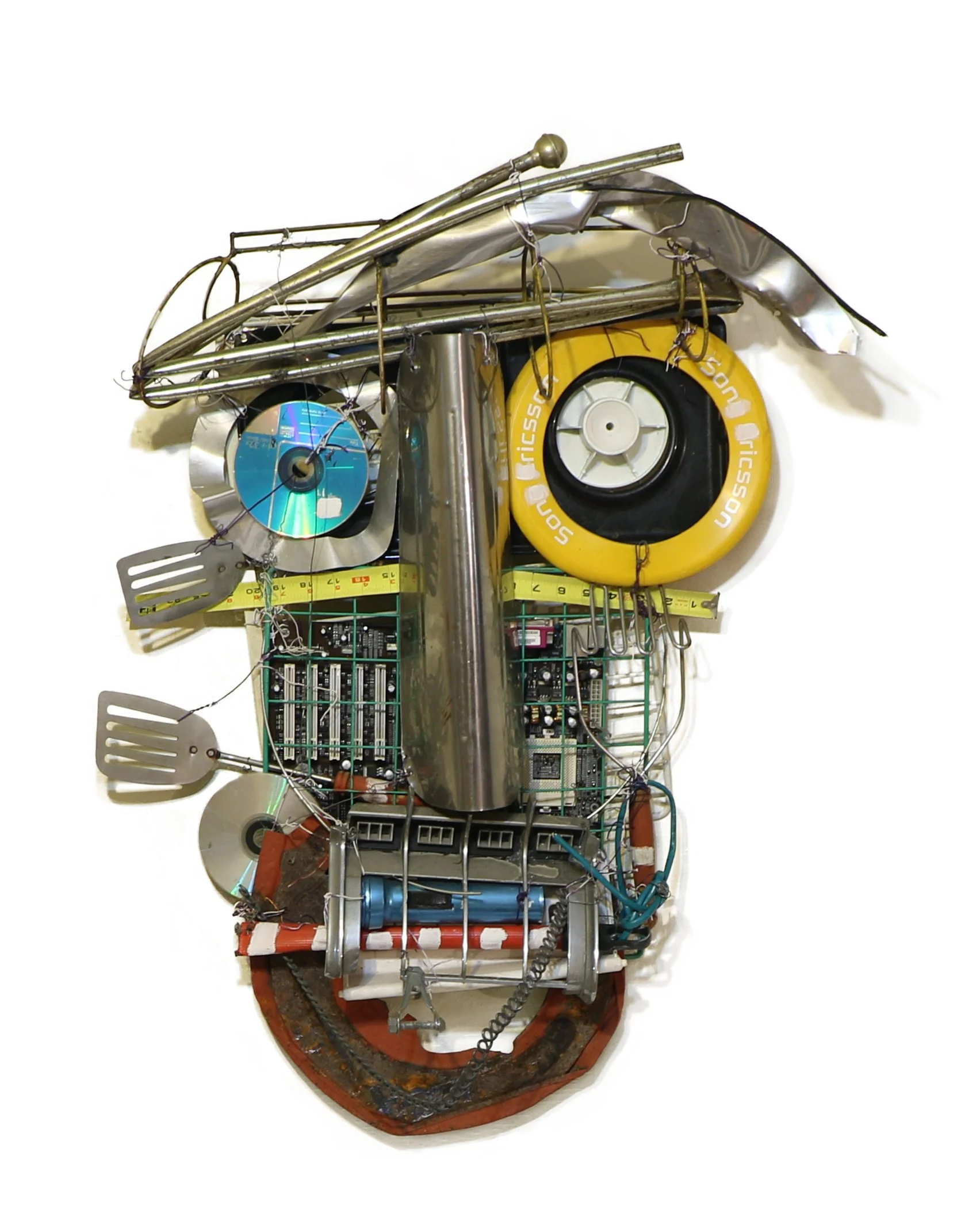 Found object sculpture by Karl A. McIntosh featuring an animal like figure made from metal, electronic components, CDs, wheels, and wires.