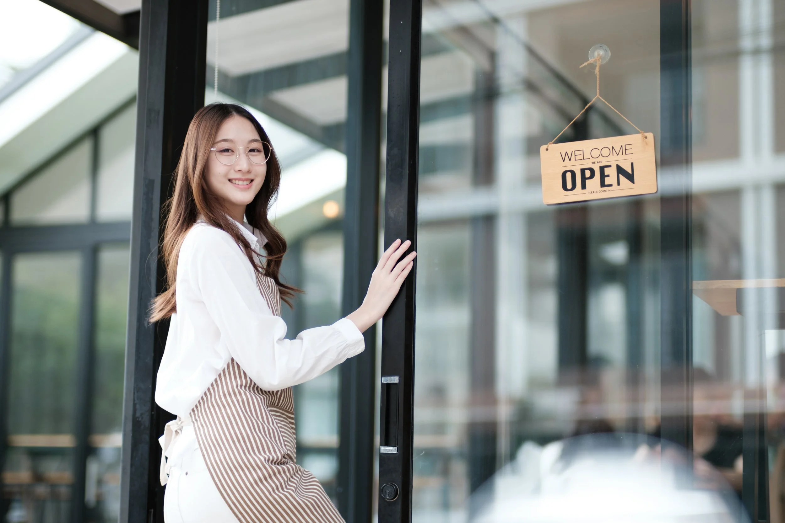 A clerk opening the shop