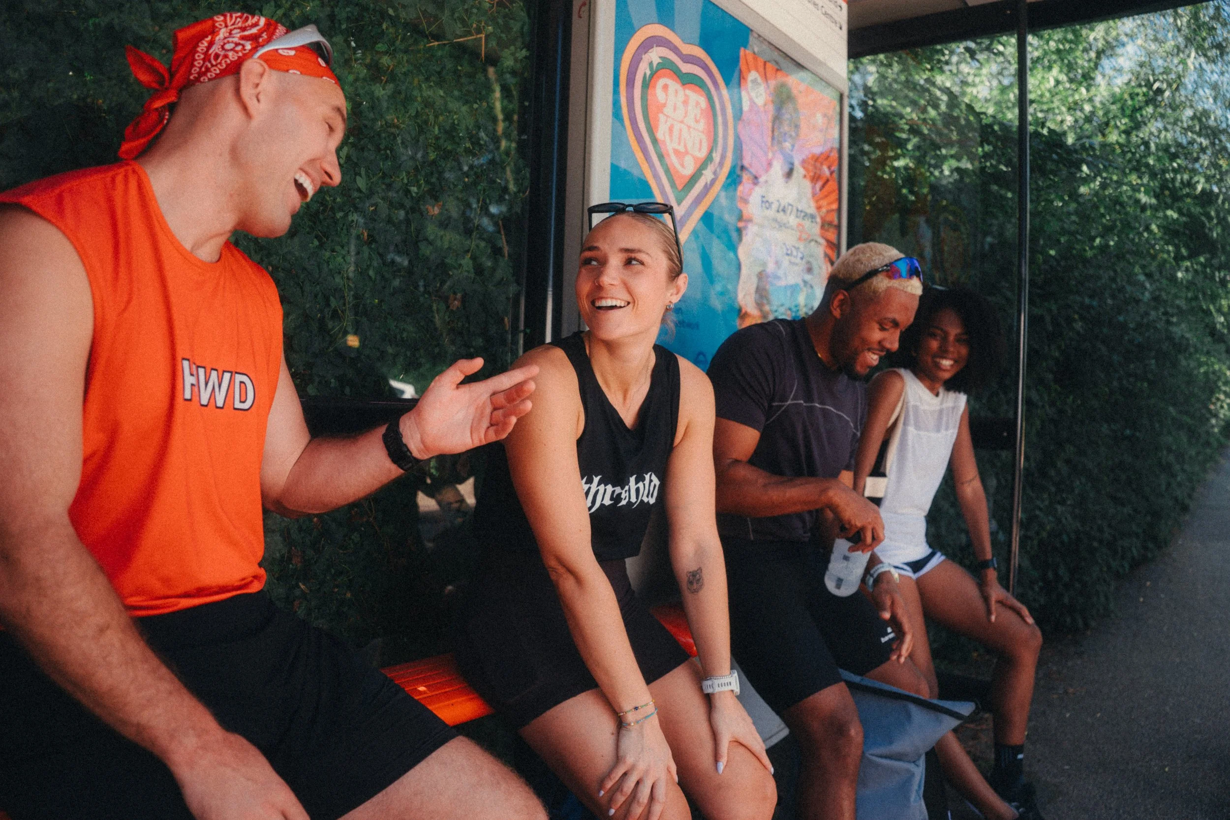 Four friends laughing together after forming their Team Marathon London team of four