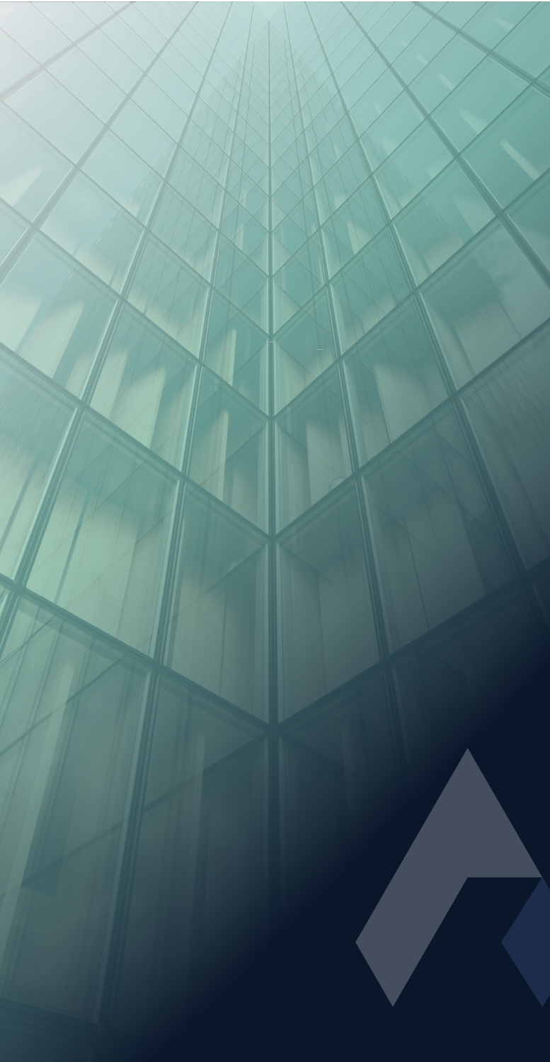 Modern glass building exterior with reflective windows, looking upward, with a stylized logo in the bottom right corner.