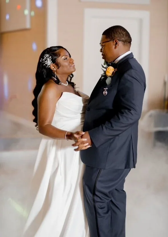 A bride and groom dancing at their wedding reception.