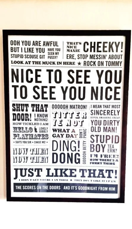 A framed collage of various black and white humorous and inspirational phrases in different fonts, including expressions like "Nice to see you"