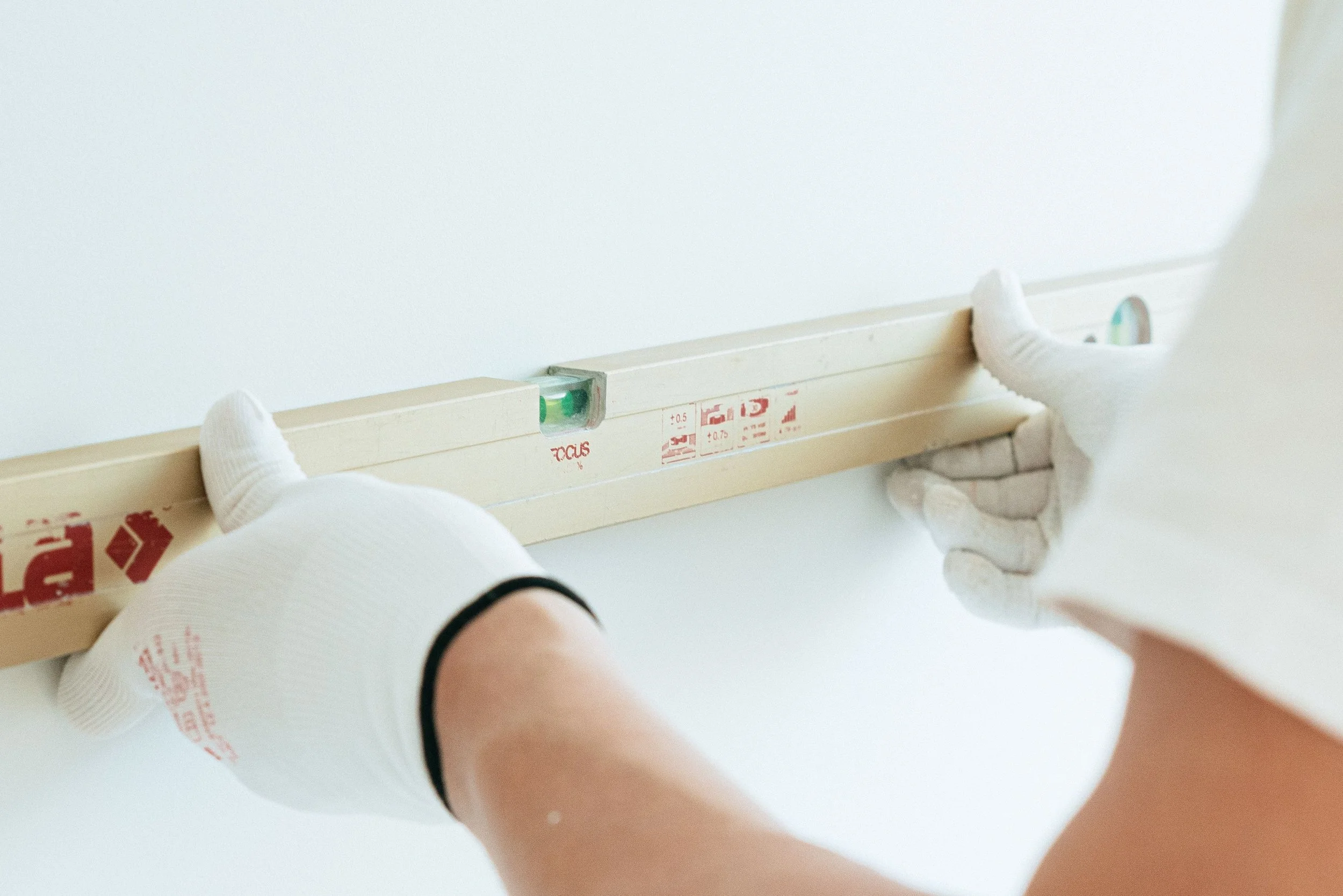 worker holding a level