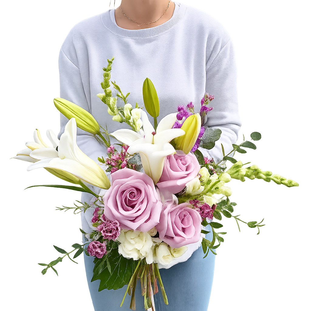 Person holding a large bouquet of pink roses, white lilies, purple statice, and assorted greenery against a plain background.