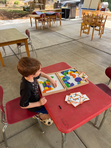 Montessori outdoor preschool ages 3-6 in woodland wa, child learning with montessori toys