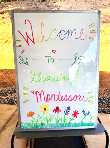 sign welcoming students age 3-6 in woodland wa at growing montessori outdoor school