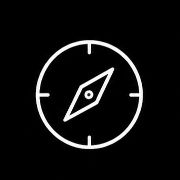 A black background with a white compass symbol in the center.