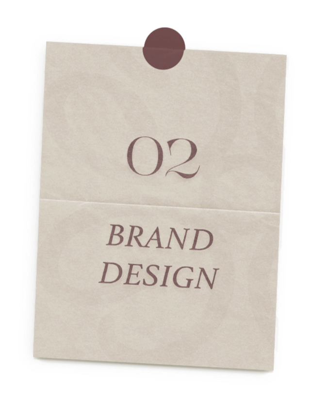 A handwritten paper note pinned with a brown circle to a surface, reading '02 BRAND DESIGN'.