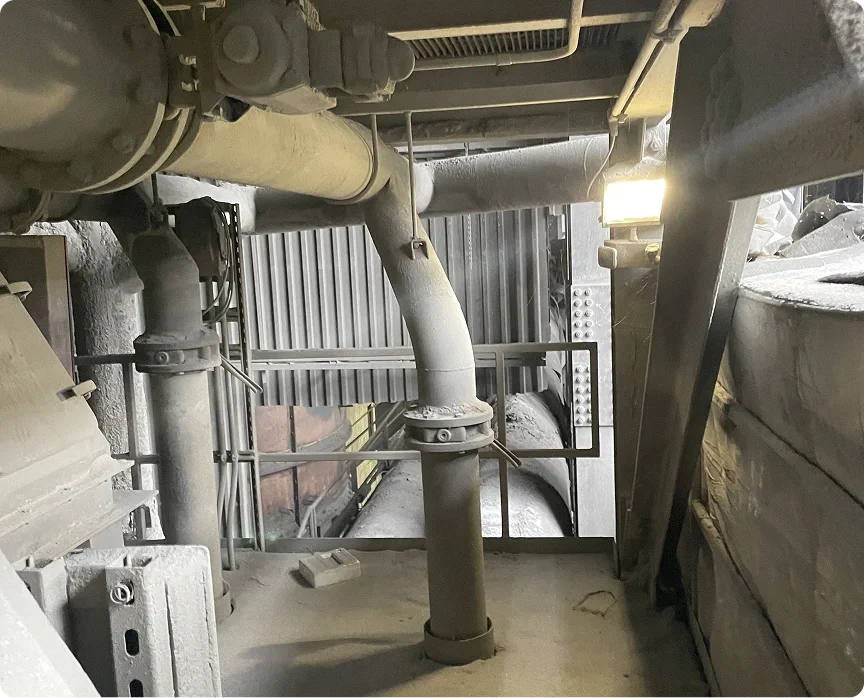 Industrial pipes and metal framework inside a factory or construction site