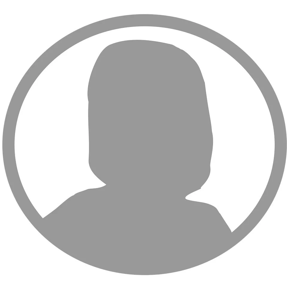 Silhouette of a person's head and shoulders inside a circle.