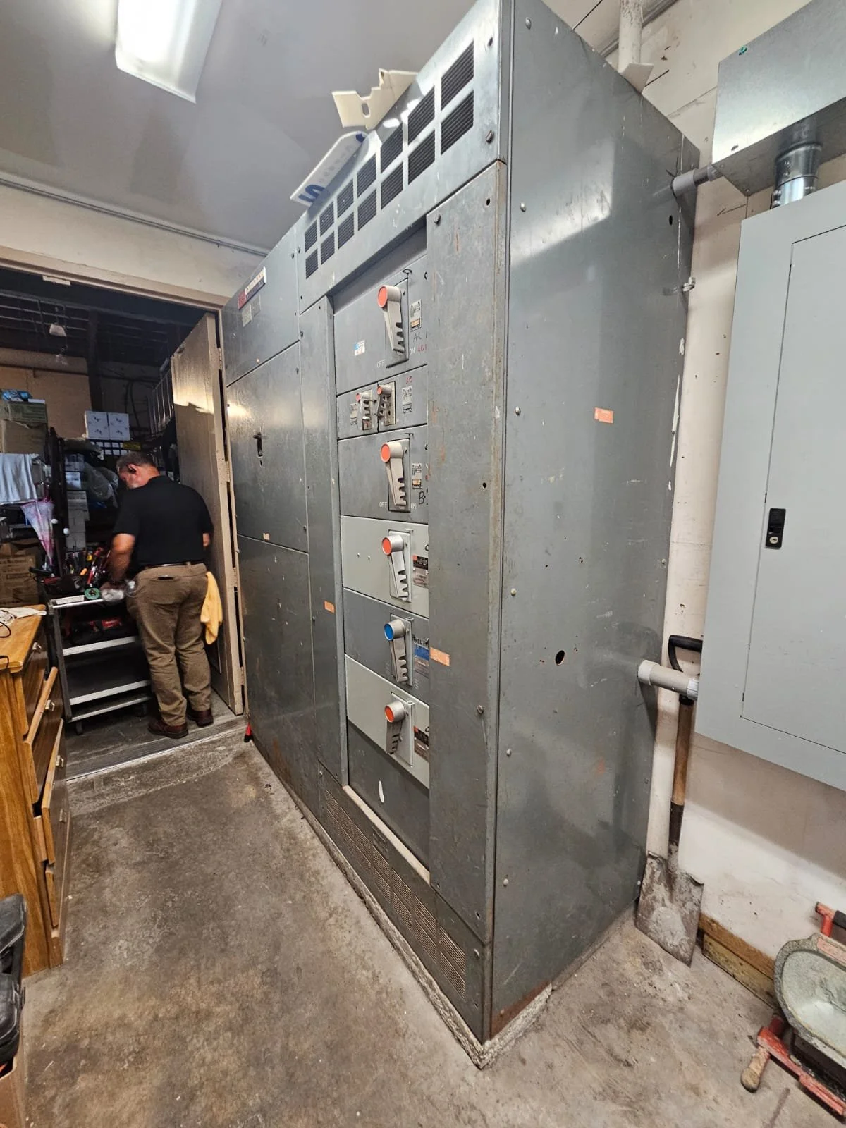 Industrial electrical panel with switches and controls.