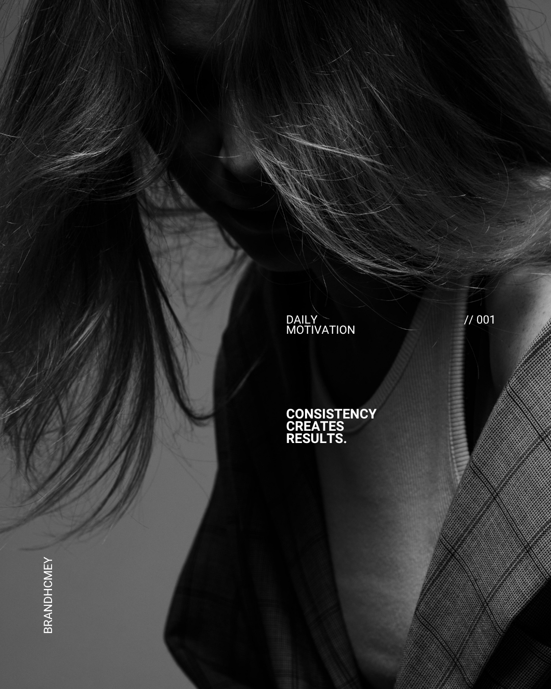 Black and white photograph of a woman with long hair covering her face, wearing a checkered blazer over a shirt with motivational text overlay, including "Daily Motivation," "Consistency Creates Results," and "// 001."